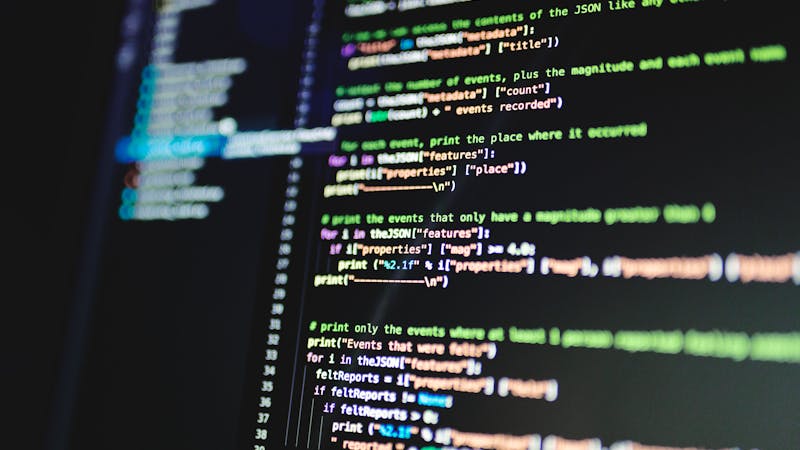 Software engineer writing code for API endpoint implementation