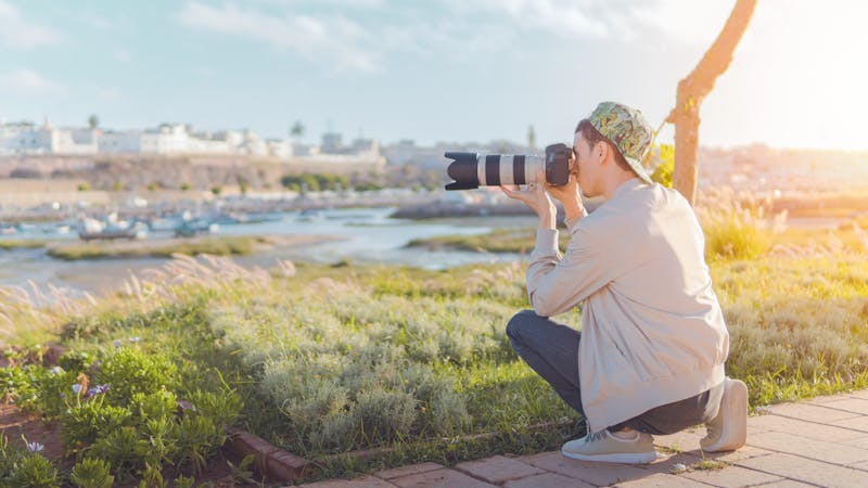 Photographer scouting a scenic location for a shoot