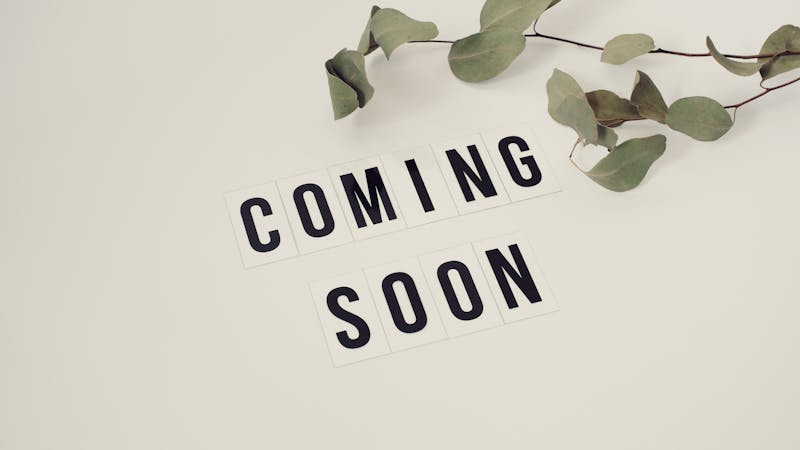 Coming soon landing page displayed on a laptop screen