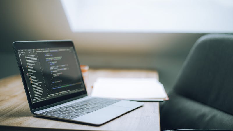 Developer focused on writing clean, well-organized code in a dark-themed editor