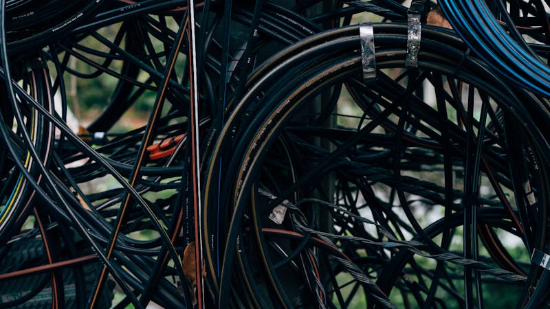 Tangled code complexity represented by intertwined wires and connections
