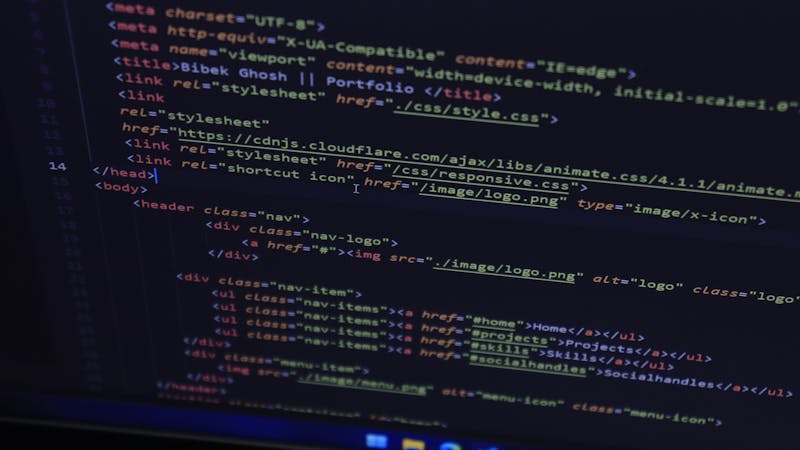 Website displayed in a dark theme on a laptop screen