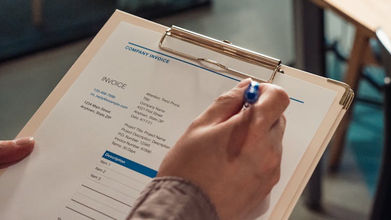 Invoice and billing documents on a desk representing transparent time tracking