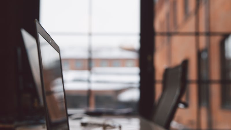 Modern office workspace with clean desk and technology setup