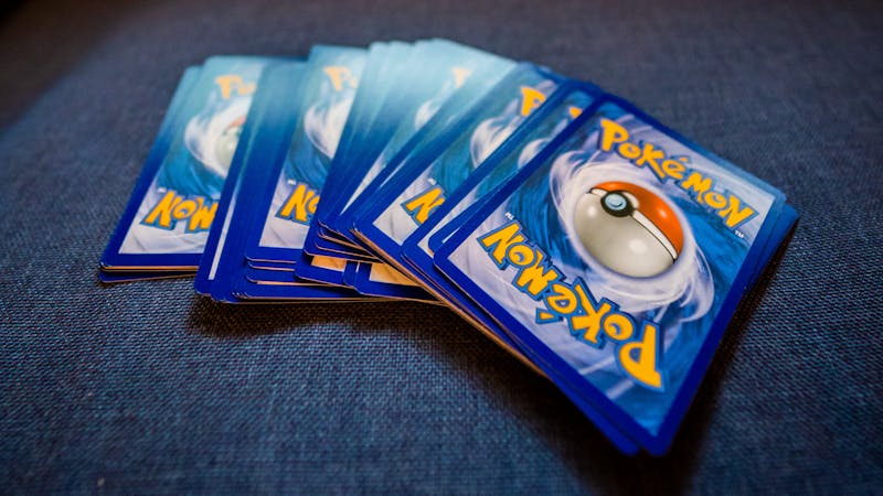 Trading cards spread out on a table ready for a card game