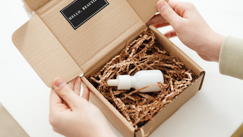 Unboxing a product package to reveal its contents