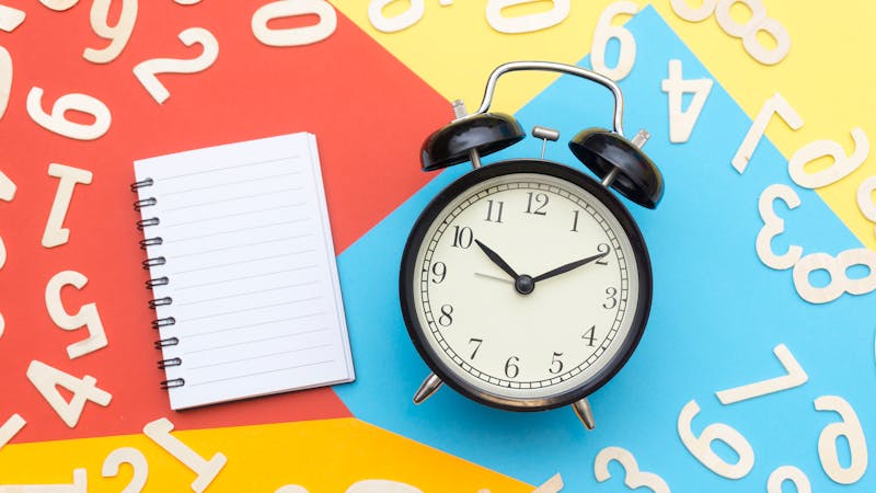 Clock and calendar representing project deadlines and planning schedules