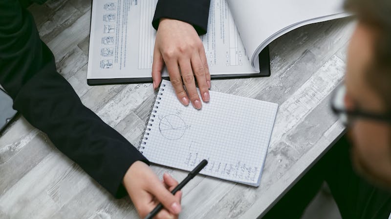 Notepad with planning notes and checklist for project documentation