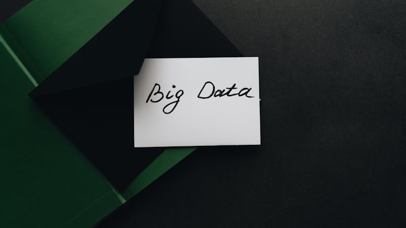 Database schema design with tables and relationships on a whiteboard