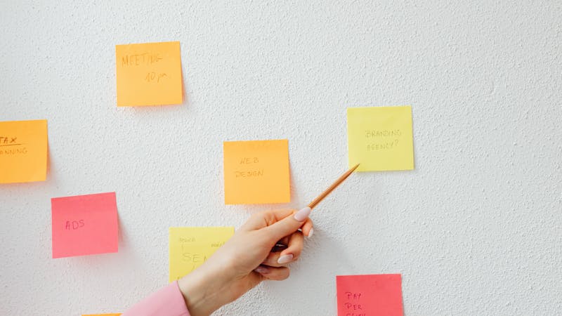 Colorful sticky notes arranged on a board during a brainstorming session