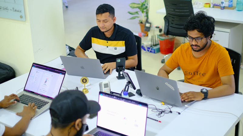 Remote team members working together from a coworking space in a tropical setting
