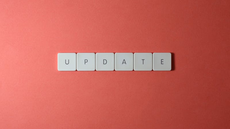 Software developer reviewing system updates on a laptop screen