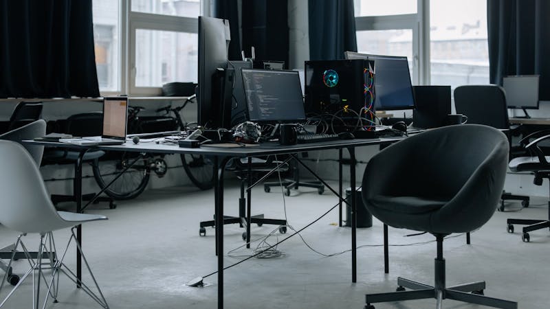 Developer workspace with multiple monitors and coding tools