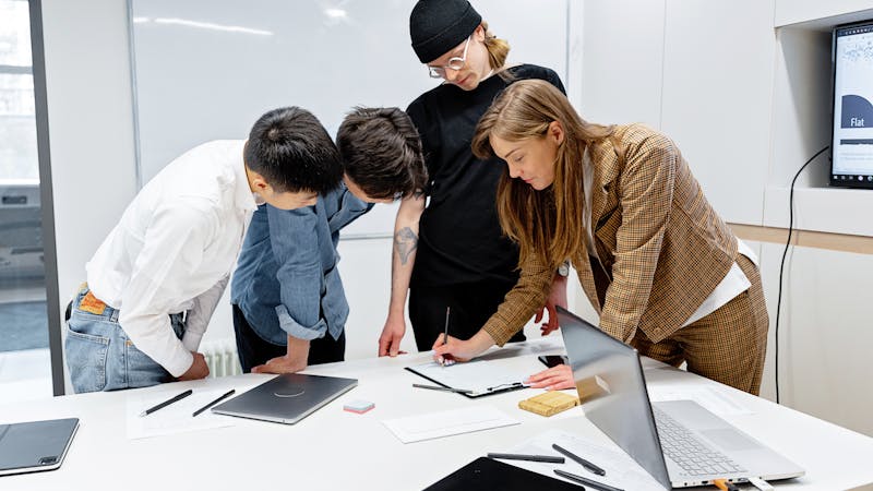 Team members collaborating during a product demonstration and feedback session