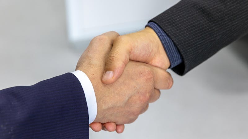 Professional handshake sealing a business partnership deal