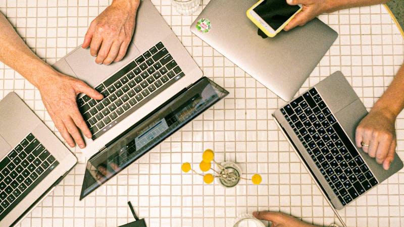Team collaborating around a table during a client agency meeting