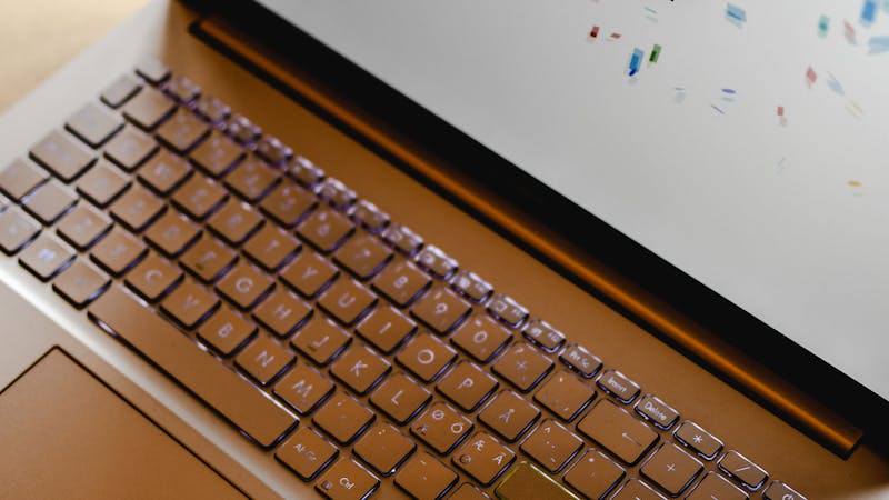 Startup founder working on laptop reviewing product plans